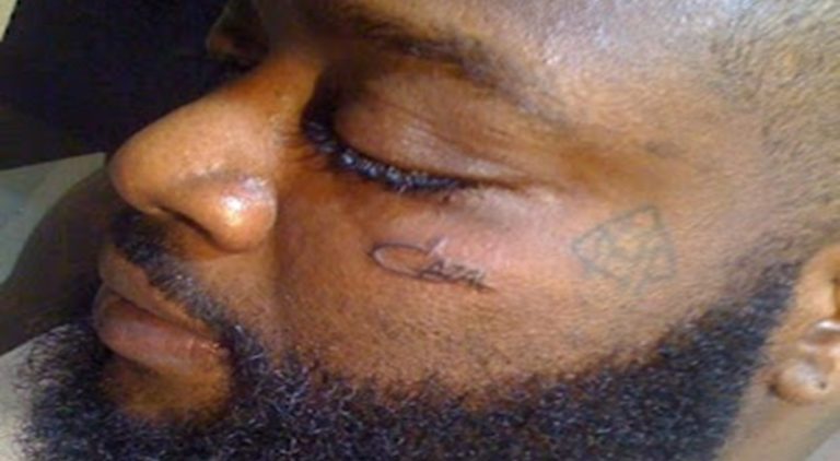 Rick Ross gets the iconic sunglass company, Cazal, tattooed on his face.