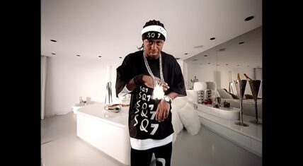 Lil Wayne flaunts his chain in "Shine" music video.