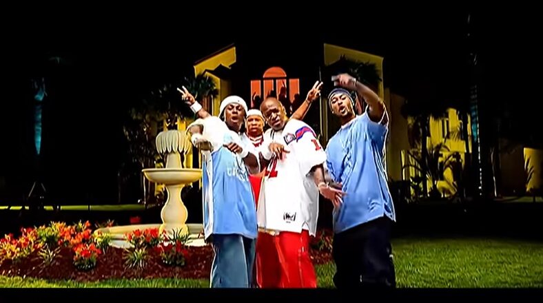 Lil Wayne, Birdman, TQ, and Mannie Fresh in front of a mansion in the "Way of Life" video