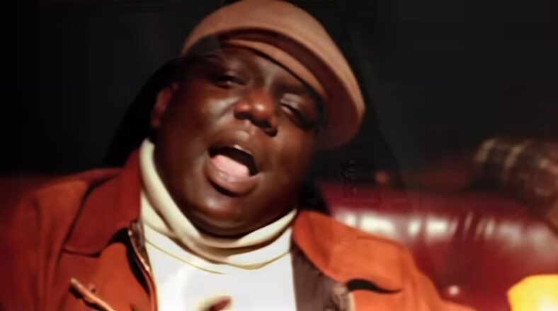 The Notorious B.I.G. in his "Big Poppa" music video, rapping.