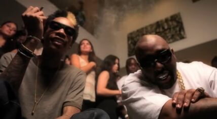 Trae Tha Truth and Wiz Khalifa in the Gettin Paid music video.
