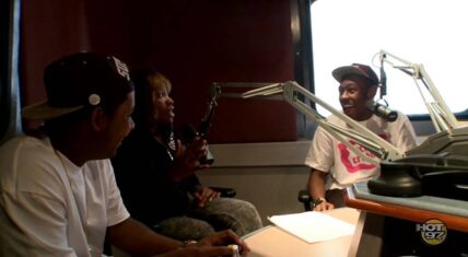 Tyler, the Creator and Jasper Dolphin sitting in a radio studio during their Hot 97 interview.
