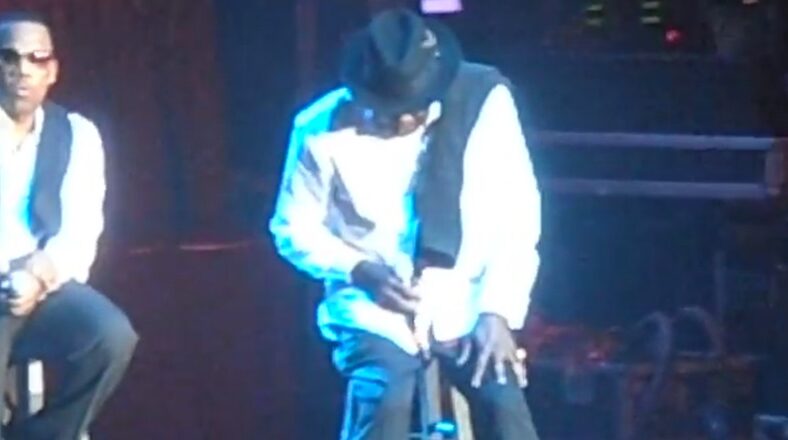 Bobby Brown performing on stage during New Edition concert as he reacts to Whitney Houston’s death.