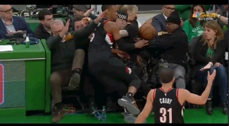 Rodney Hood causes Jadakiss to spill beer on himself, at Celtics game
