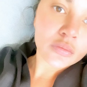 Chrissy Teigen is playing music from John Legend's upcoming album, and threatens to leak it. In the Instagram comments, John Legend jokes that he'll take it as free promotion. Chrissy, in turn refers to him as "b*tch," jokingly, and says this promotion isn't free.