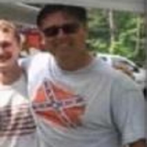 Todd Bennett, a police officer, in Belleville, Ontario, in Canada, shared a photo of himself wearing a Confederate flag t-shirt. One of his friends commented, asking if he was wearing a treason t-shirt. He replied that he was wearing the "real" independence day flag, and "The South will rise again," a George Wallace quote.