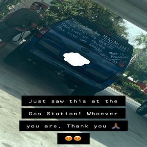 Danette Allen has one of the most-shared posts on Facebook, right now. Unlike many heavily-shared posts, Danette Allen's is a positive one. While she was out, she spotted a white man pumping gas, and his back mirror contained writing, supporting Black lives, saying "matter" is the minimum for black lives, saying black lives are worthy, needed, beloved, and black is beautiful, including the #POCUnity hashtag, and the post has gone viral, on Facebook.