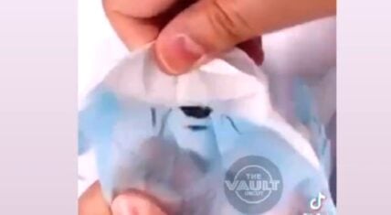 Girl finds spider in face mask