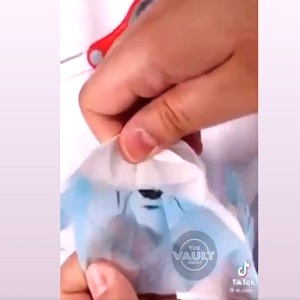 Girl finds spider in face mask