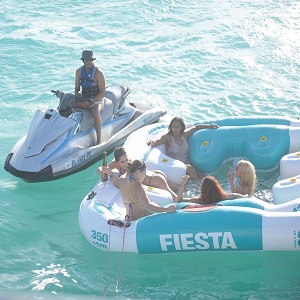 T.I. with women beside yacht
