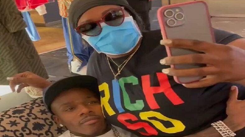 DaBaby has a female fan sitting on his lap