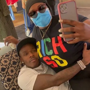 DaBaby has a female fan sitting on his lap
