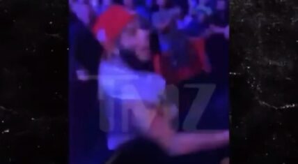 6ix9ine tries to fight fan who throws a can of beer at him