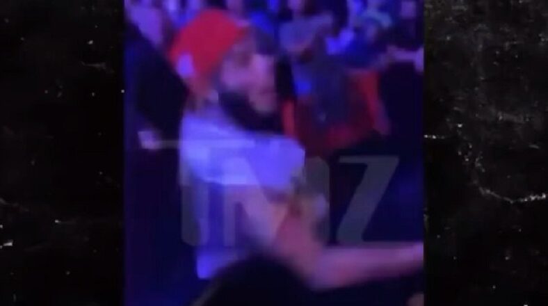 6ix9ine tries to fight fan who throws a can of beer at him