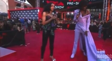 Lil Nas X asks reporter if his VMAs outfit looks good and he laughs and says I won't say all that
