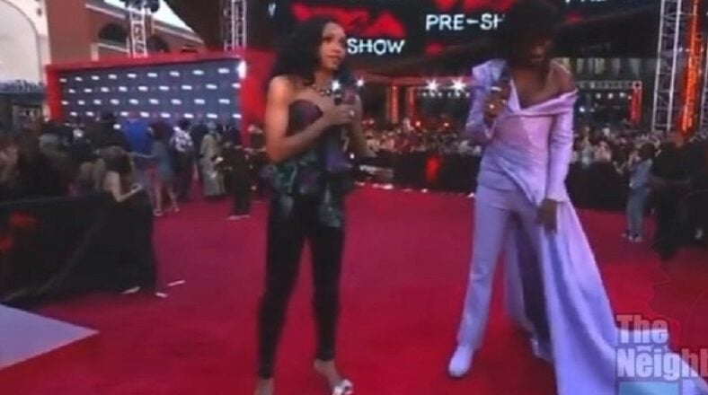 Lil Nas X asks reporter if his VMAs outfit looks good and he laughs and says I won't say all that