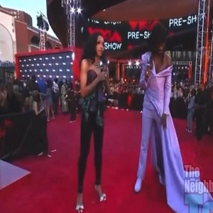 Lil Nas X asks reporter if his VMAs outfit looks good and he laughs and says I won't say all that