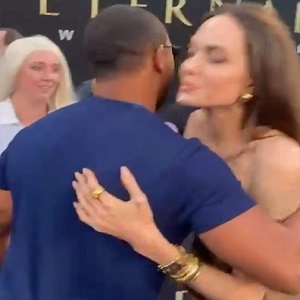 Angelina Jolie flirts with Romeo Miller on the Eternals red carpet