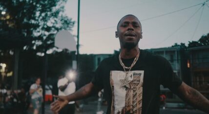 YBS Skola holds down his hood in Westside video