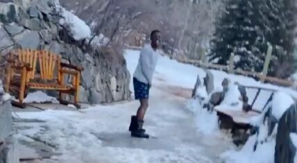 Boosie runs in the snow wearing his underwear