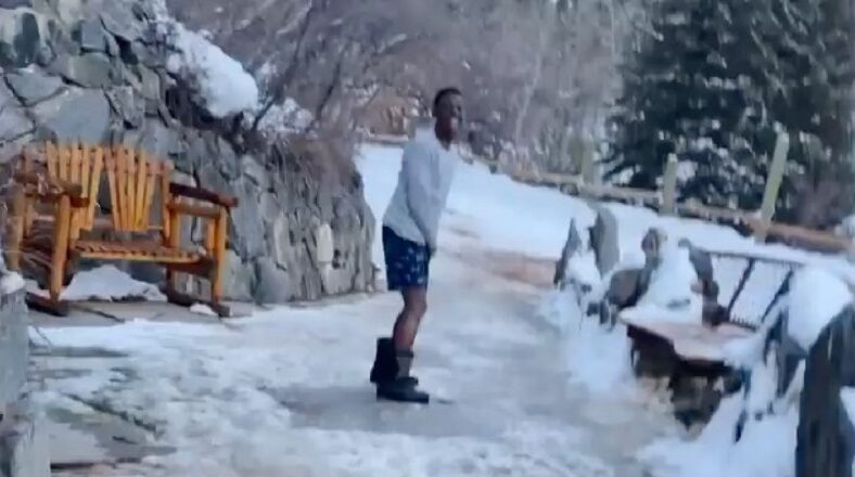 Boosie runs in the snow wearing his underwear