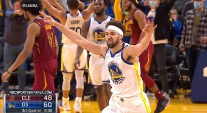 Klay Thompson celebrates hitting his 1800th three-pointer