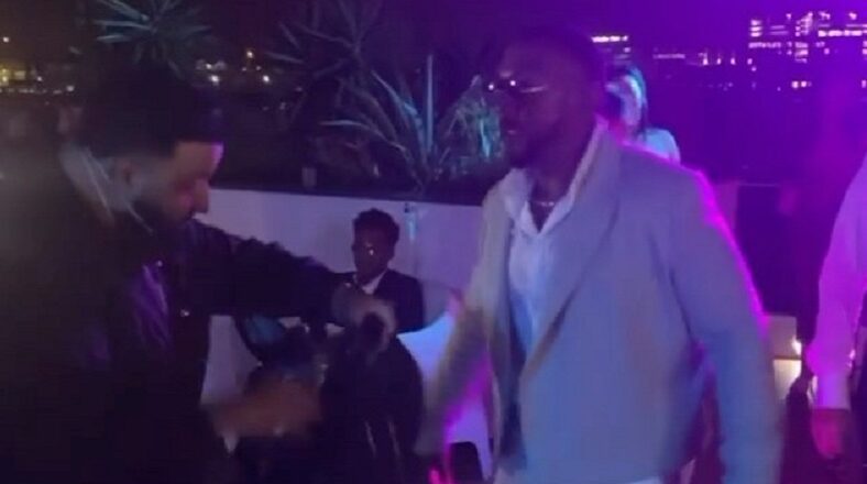 DJ Khaled gives Timbaland a Louis Vuitton bag that lights up