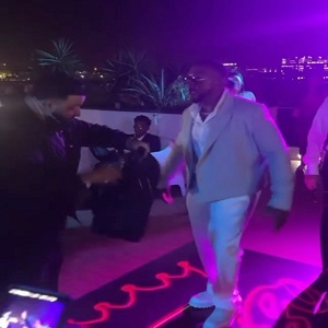 DJ Khaled gives Timbaland a Louis Vuitton bag that lights up