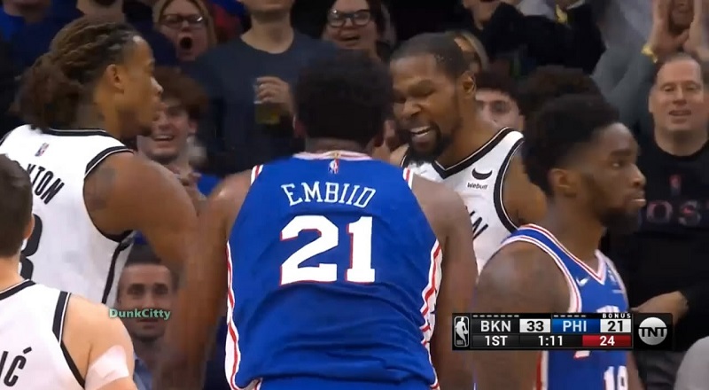 Kevin Durant fights with Joel Embiid after he knocks him down
