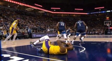 LeBron James gets elbowed in the face and falls to the ground
