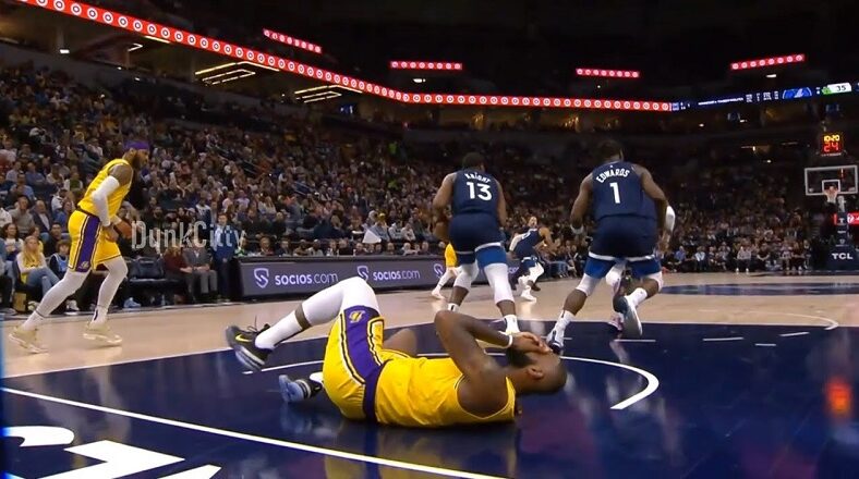 LeBron James gets elbowed in the face and falls to the ground