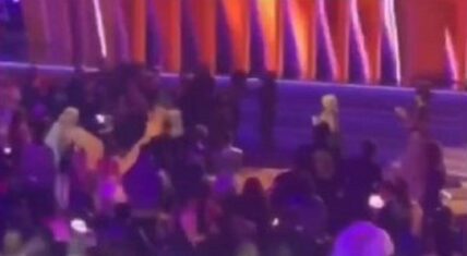 Doja Cat runs from the bathroom to accept her Grammy on stage