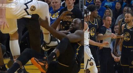 Draymond Green grabs Aaron Gordon's leg and tries to trip him