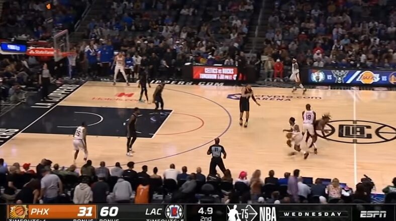 Terance Mann collapses on the court after colliding with Bismack Biyombo