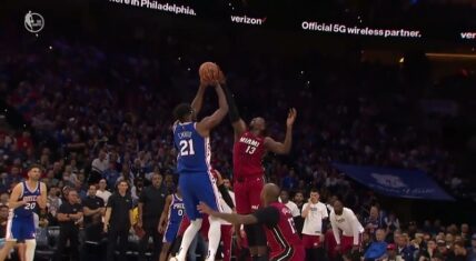 Bam Adebayo blocks Joel Embiid while the Heat double team him