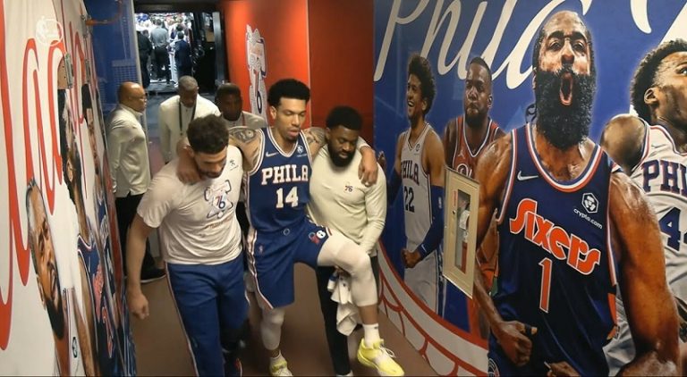 Danny Green carried to locker room after Joel Embiid falls on his knee