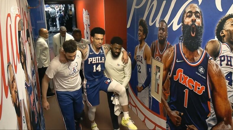 Danny Green carried to locker room after Joel Embiid falls on his knee