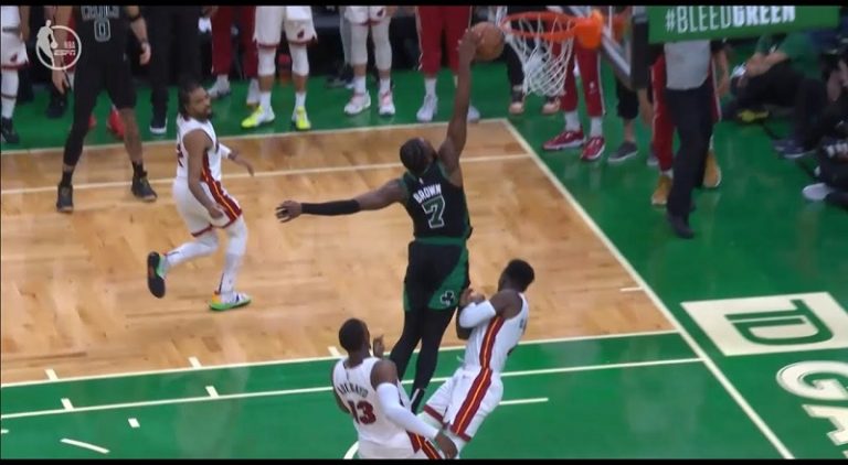 Jaylen Brown tries to dunk on Victor Oladipo but gets offensive foul call