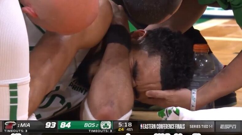 Jayson Tatum cries after he hurt his shoulder