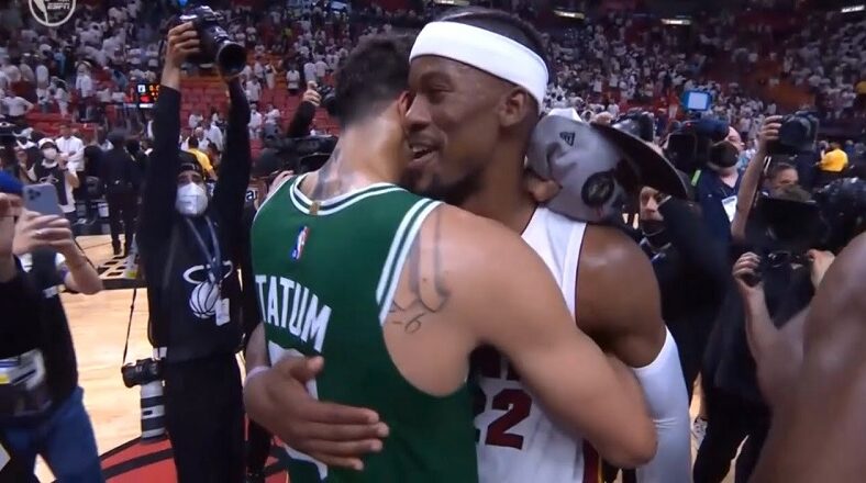 Jimmy Butler hugs Jayson Tatum and tells him to go win it