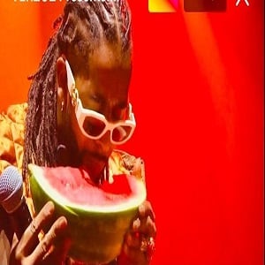 Omarion eats a watermelon while doing Verzuz battle