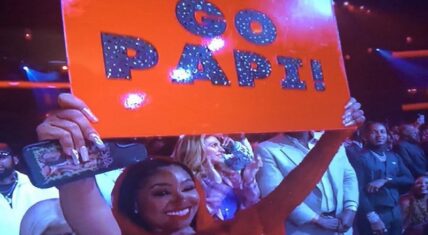 Yung Miami holds Go Papi sign for Diddy at BET Awards