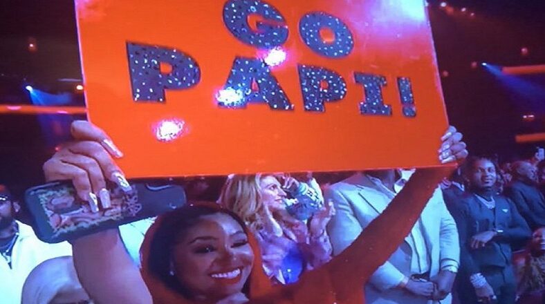 Yung Miami holds Go Papi sign for Diddy at BET Awards