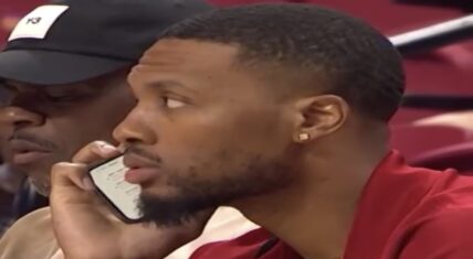 Damian Lillard pretends to be talking on phone at Summer League