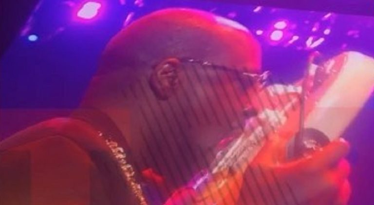 Wyclef Jean plays the guitar with his tongue at Essence Fest