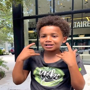 DaBaby gives a kid $200 after he raps for him