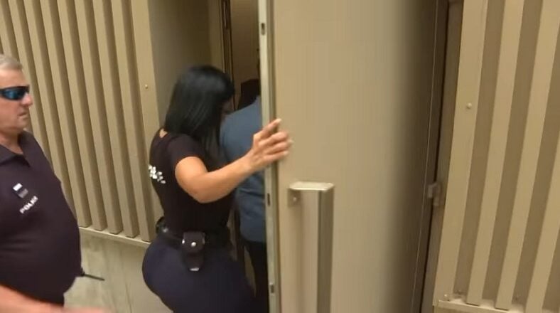 Female officer's bottom steals attention from arrest