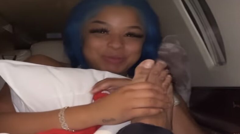 Chrisean Rock plays with Blueface's foot on jet