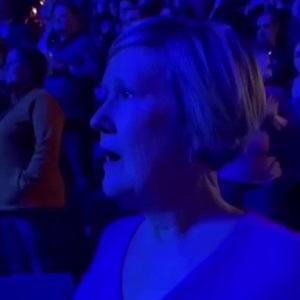Older white woman goes into a trance during Kevin Gates concert
