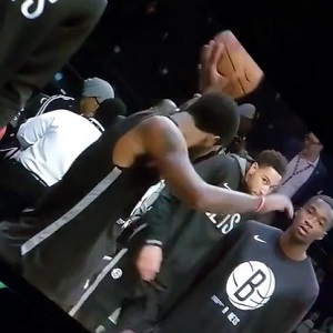 Ben Simmons misses a shot and the ball hits Kyrie Irving in the face